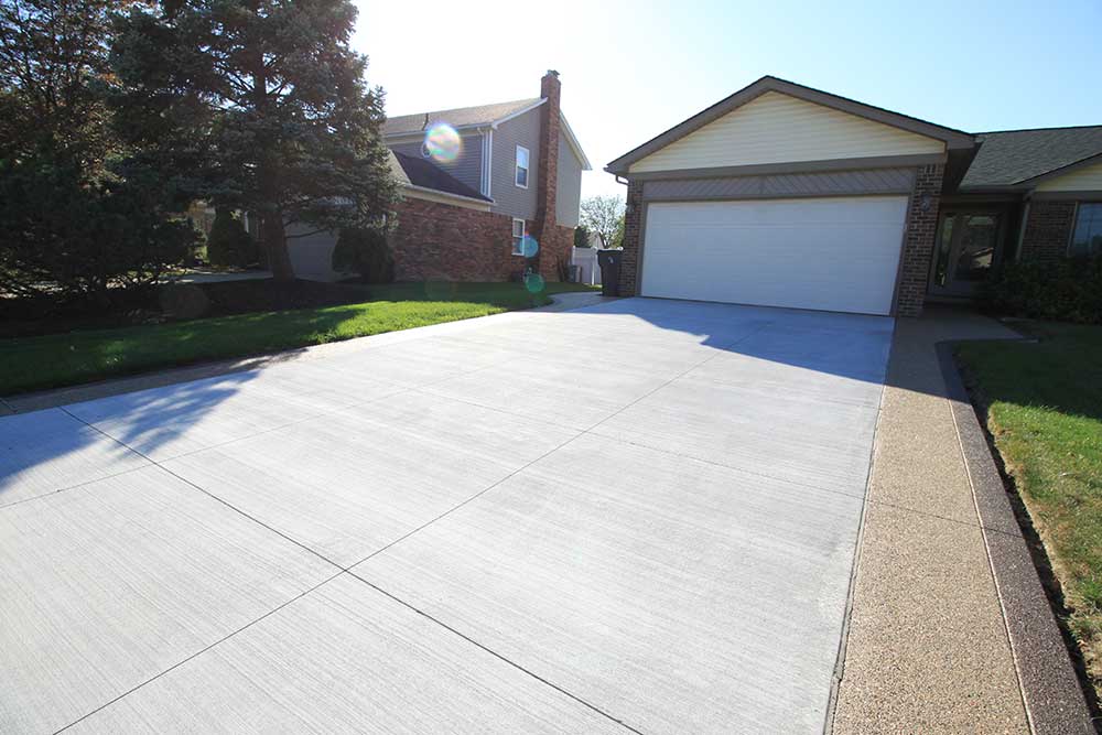 Plain Cement Driveway with Exposed Driveway Extensions