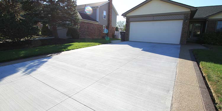 Concrete driveway with exposed aggregate extensions in Macomb Township
