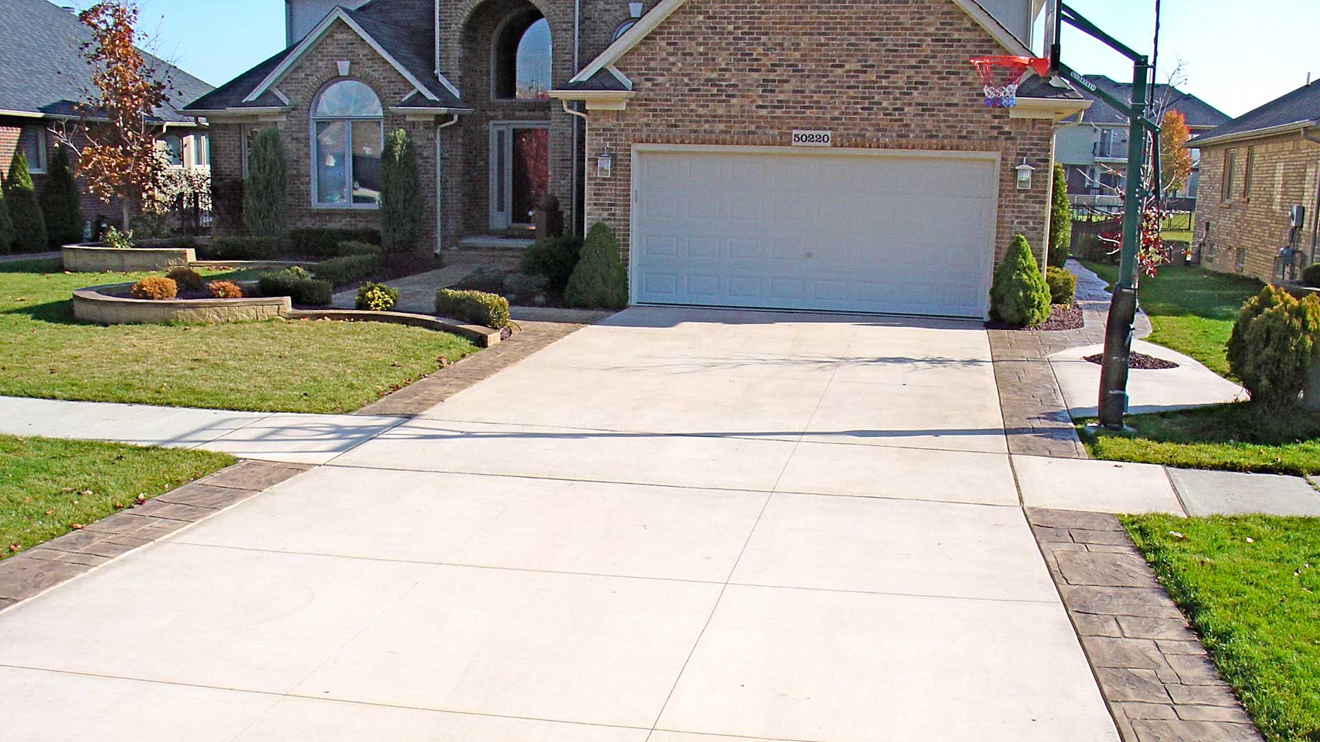 Driveway Replacements With Stamped Concrete Ribbons In Macomb Township