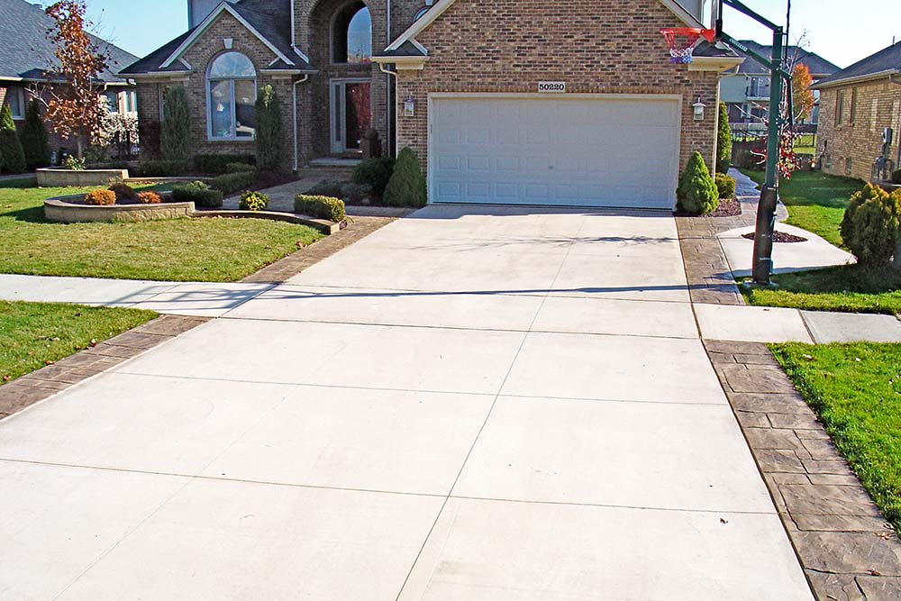 Plain Cement Driveway with Stamped Border in Michigan