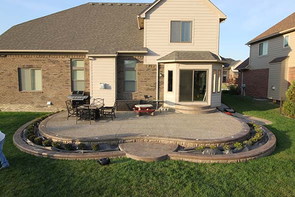 Exposed Aggregate Patio with Retaining Wall in Macomb Township, MI